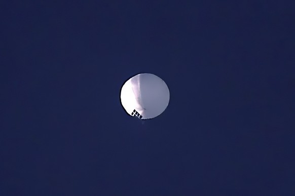 A high altitude balloon floats over Billings, Mont., on Wednesday, Feb. 1, 2023. The huge, high-altitude Chinese balloon sailed across the U.S. on Friday, drawing severe Pentagon accusations of spying ...