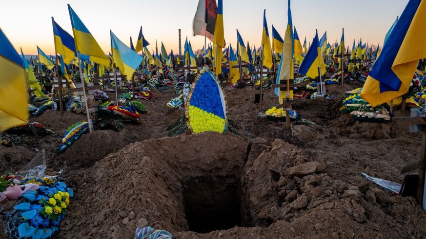 KHARKIV, UKRAINE - JANUARY 24: Ukrainian flags are placed on the graves of soldiers at a Khrakiv cemetery on January 24, 2023 in Kharkiv, Ukraine. Nearly one year after Russian President Vladimir Puti ...