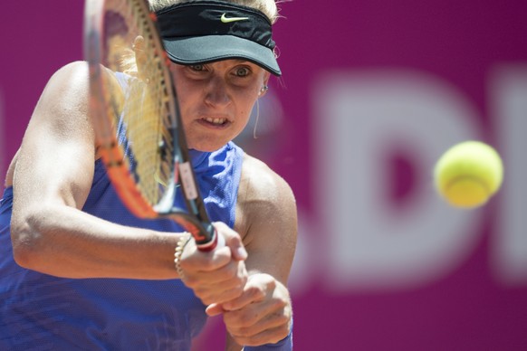 Jil Teichmann of Switzerland returns a ball to Tamara Korpatsch of Germany during a first round game at the WTA Ladies Championship tennis tournament in Gstaad, Switzerland, Tuesady, July 18, 2017. (P ...