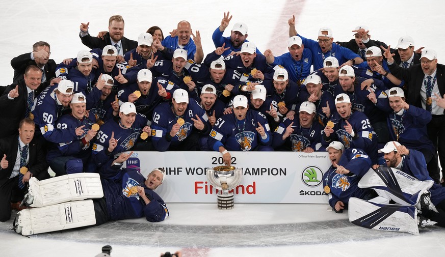 Team Finland poses for a photo after the Hockey World Championship final match between Finland and Canada, Sunday May 29, 2022, in Tampere, Finland. Finland won 4-3 in overtime. (AP Photo/Martin Meiss ...