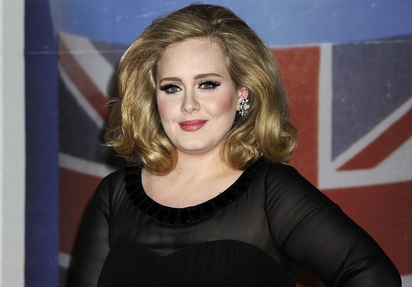 FILE - In this Feb. 21, 2012 file photo, performer Adele arrives for the Brit Awards 2012 at the O2 Arena in London. Four years after her last album, the singer appears to have teased British televisi ...