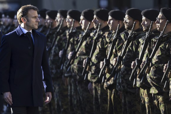 French President Emmanuel Macron inspects the guard of honour of the Swiss army in front of the Federal Palace, the Swiss Parliament building, in Bern, Switzerland, Wednesday, Nov. 15, 2023. French Pr ...