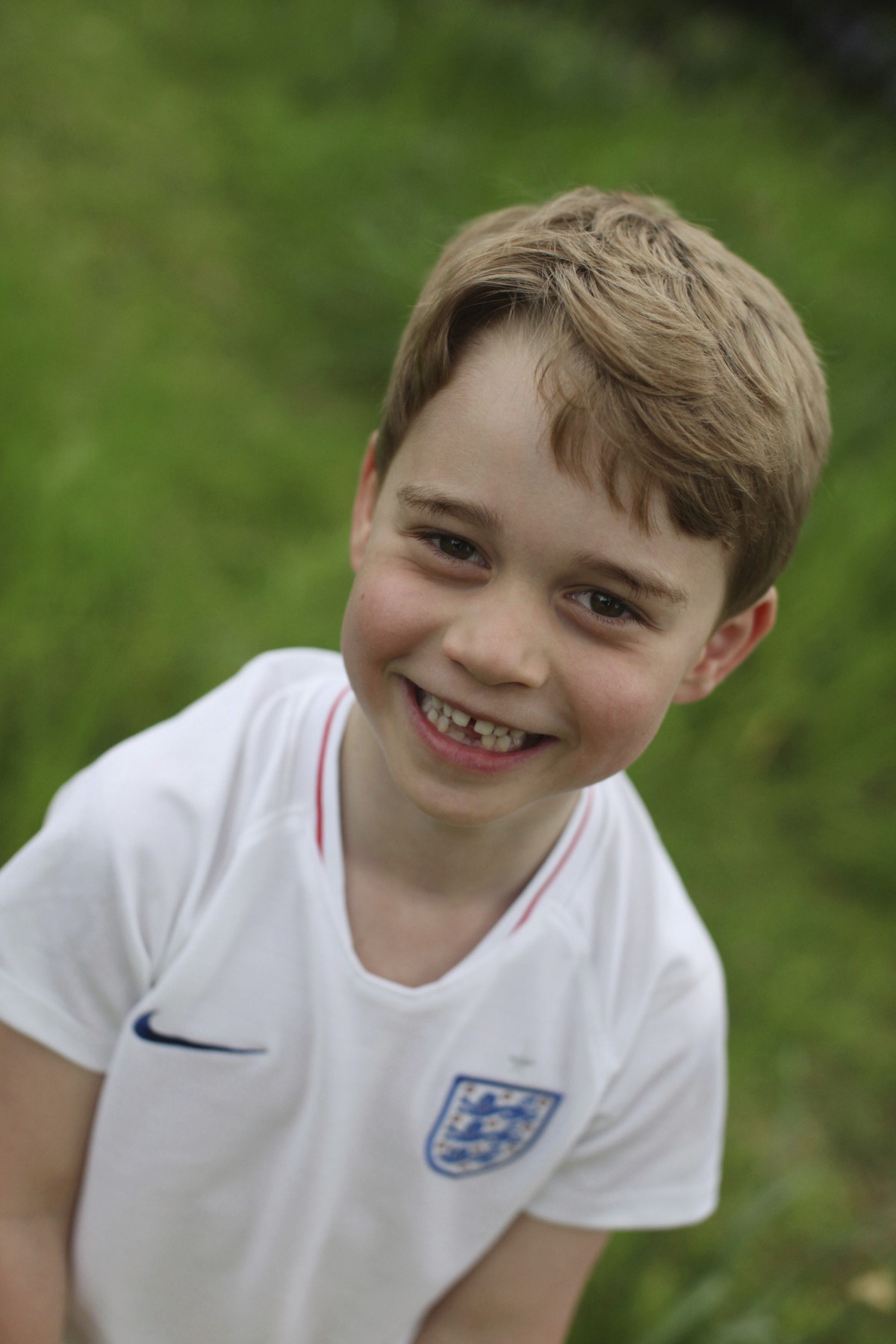 In this undated photo released by the Duke and Duchess of Cambridge on Sunday, July 21, 2019, Britain's Prince George poses for a photo taken by his mother, Kate, the Duchess of Cambridge, in the ...