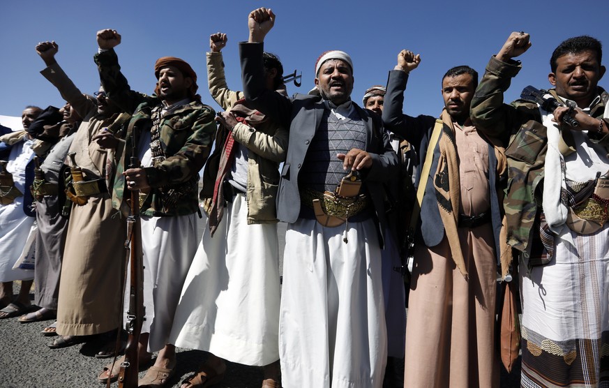 epa08987239 Houthis-allied tribesmen shout slogans during a rally against the US terrorist designation of the Houthis, in Sana