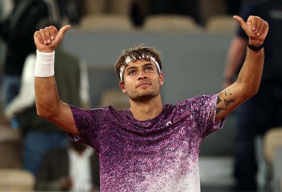 epa13013719 Flavio Cobolli of Italy celebrates winning his Men's quarterfinal match against Felix Auger Aliassime of Canada at the French Open Grand Slam tennis tournament at Roland Garros in Par ...