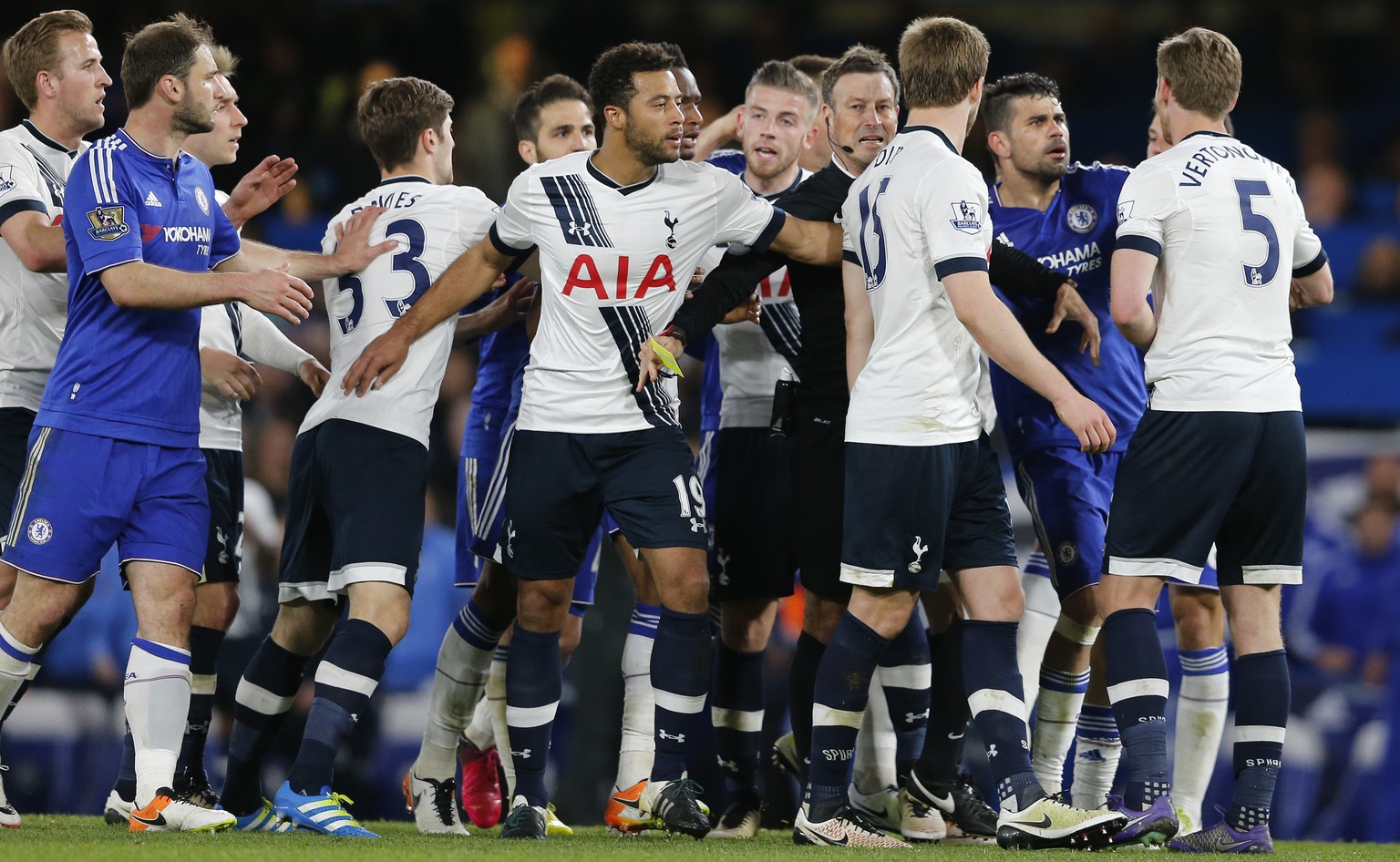 FILE - In this Monday, May 2, 2016 file photo, referee Mark Clattenburg talks with Chelsea and Tottenham Hotspur players during the English Premier League soccer match at Stamford Bridge stadium in Lo ...