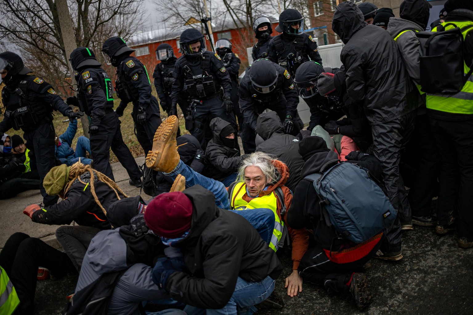 epa11818067 Riot police clash with demonstrators blocking a road near the conference hall ahead of the Alternative for Germany (AfD) federal conference, in Riesa, Germany, 11 January 2025. The AfD wil ...