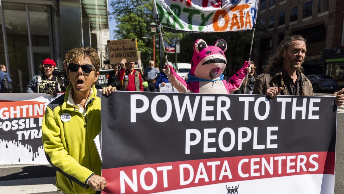epa12905104 Activists protest the environmental consequences of data center expansion outside a data center conference in Washington, DC, USA, 21 April 2026. Activists equated the centers, which are i ...