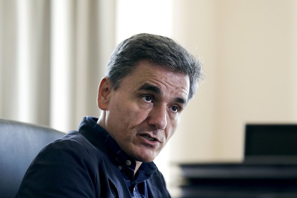 Greek Deputy Foreign Minister and coordinator of the negotiating team for the talks between Greece and its international lenders, Euclid Tsakalotos, speaks during an interview with Reuters at his mini ...