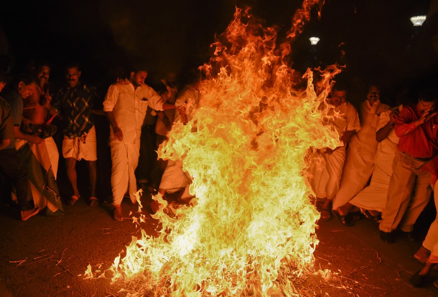 Opposition Congress party activists burn an effigy of Chief Minister Pinarayi Vijayan reacting to reports of two women of menstruating age entering the Sabarimala temple, one of the world&#039;s large ...