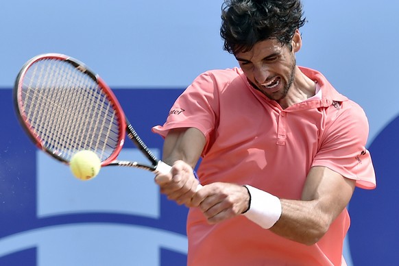 Thomaz Bellucci of Brasil returns the ball to Pablo Andujar of Spain during their quarterfinal match at the Swiss Open tennis tournament in Gstaad, Switzerland, Friday, July 31, 2015. (Peter Schneider ...