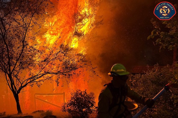 epa13148329 A handout photo made available by the Spokane Valley Fire Department shows the Fairview Fire northeast of Spokane, Washington, USA, 02 August 2026 (released on 03 August 2026). Wildfires i ...