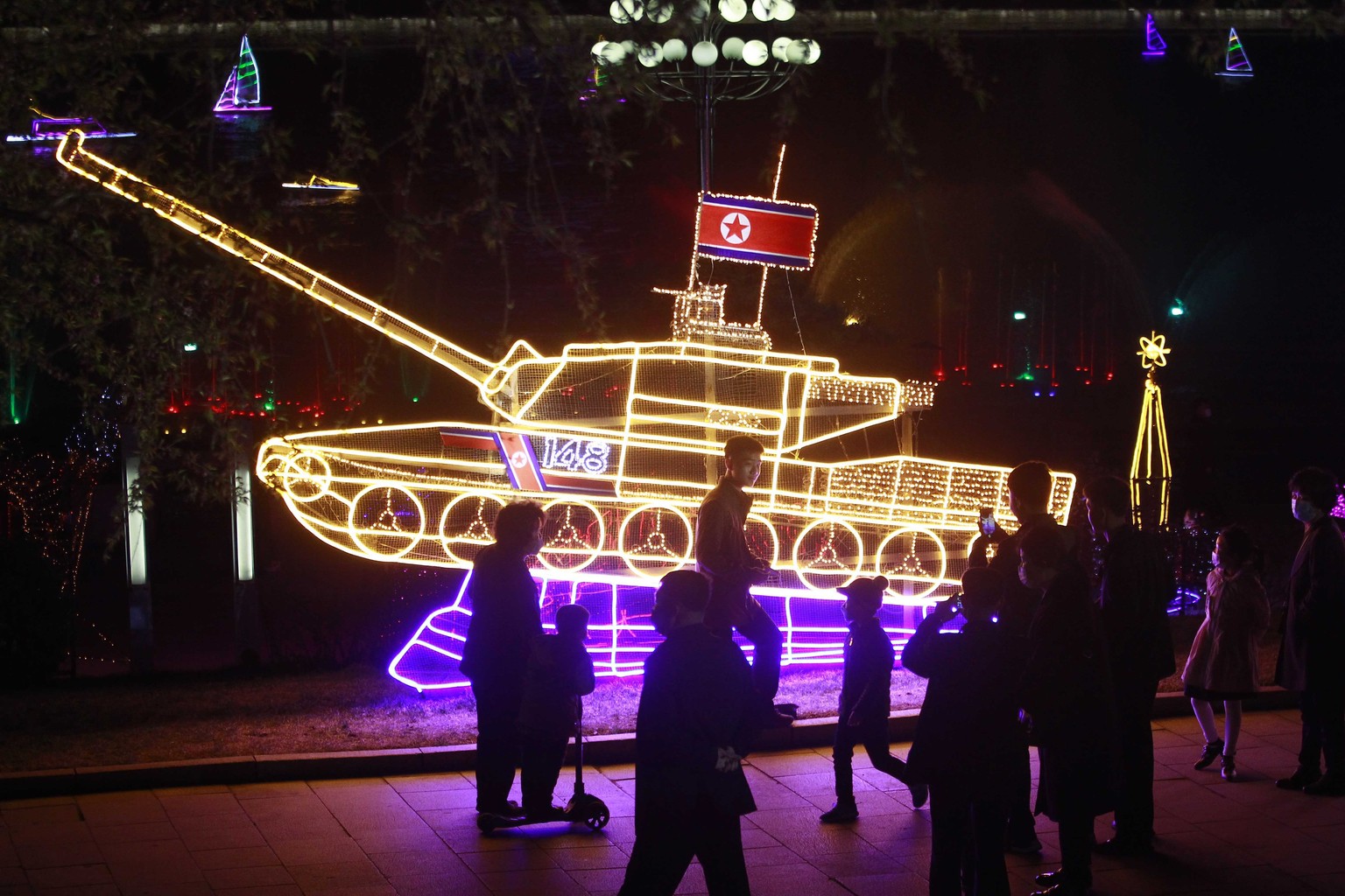 Citizens visit a light festival in celebration of 110th birth anniversary of their late leader Kim Il Sung at Kim Il Sung Square in Pyongyang, North Korea Thursday, April 14, 2022. (AP Photo/Cha Song  ...