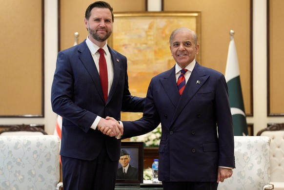 U.S. Vice President JD Vance, left, shakes hands with Pakistan's Prime Minister Shehbaz Sharif, Saturday, April 11, 2026, while meeting in Islamabad for talks about Iran. (AP Photo/Jacquelyn Mart ...