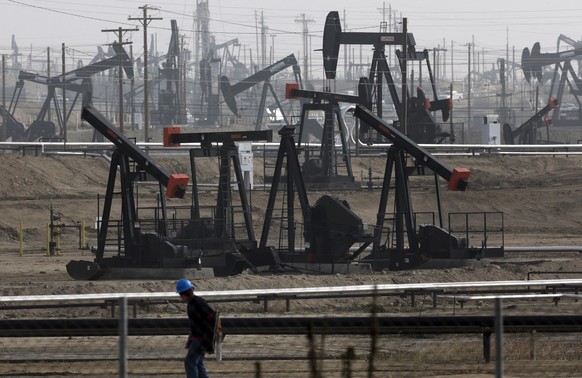 FILE - This Jan. 16, 2015 file photo shows pumpjacks operating at the Kern River Oil Field in Bakersfield, Calif. The price of oil topped $50 a barrel this week for the first time since July, deliveri ...
