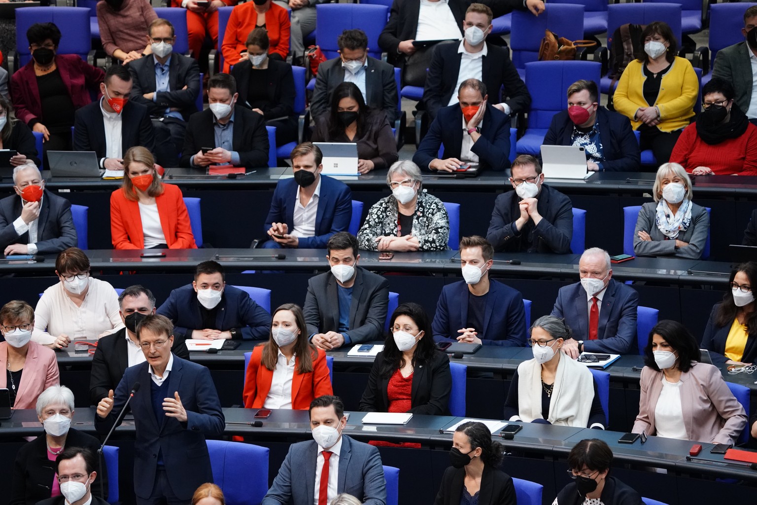 epa09875065 German Health Minister Karl Lauterbach (L) answers from his Member of Parliament's seat during a debate of the German Bundestag in Berlin, Germany, 07 April 2022. Among other topics, the m ...