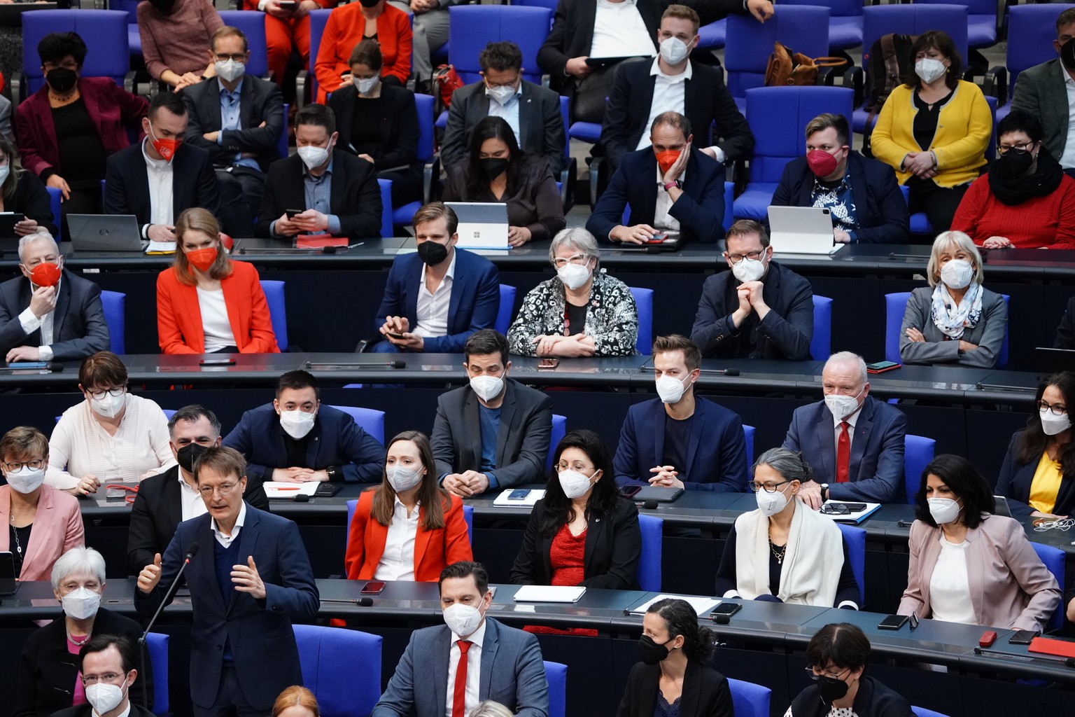 epa09875065 German Health Minister Karl Lauterbach (L) answers from his Member of Parliament&#039;s seat during a debate of the German Bundestag in Berlin, Germany, 07 April 2022. Among other topics,  ...