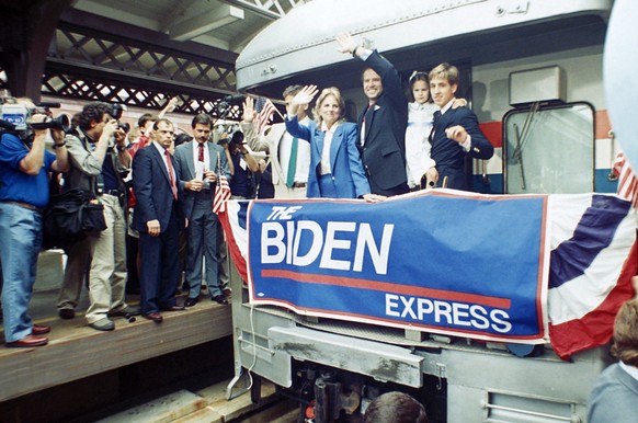 FILE - In this June 9, 1987, file photo Sen. Joe Biden, D-Del., waves from his train as he leaves Wilmington, Del., after announcing his candidacy for president. At right, son Beau carries daughter; t ...