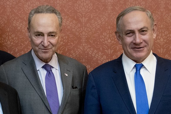 FILE - Israeli Prime Minister Benjamin Netanyahu, right, poses for a picture with Senate Minority Leader Chuck Schumer of New York, on Capitol Hill in Washington, Feb. 15, 2017. Schumer is calling on  ...