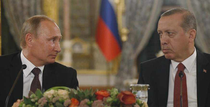 Turkey&#039;s President Recep Tayyip Erdogan, right and Russian President Vladimir Putin, left, look at each other during a news conference following their meeting in Istanbul, Monday, Oct. 10, 2016.  ...