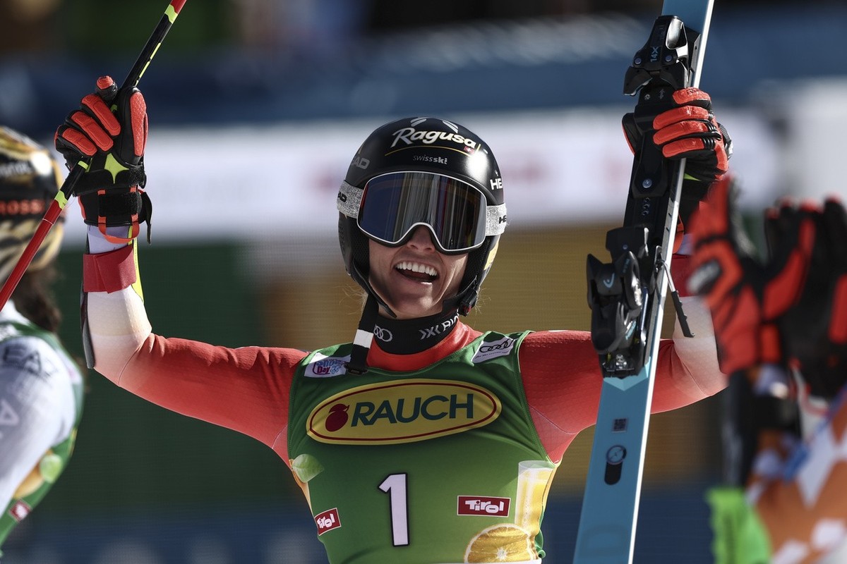 Switzerland's Lara Gut Behrami celebrates winning an alpine ski, women's World Cup giant slalom race, in Soelden, Austria, Saturday, Oct. 28, 2023. (AP Photo/Gabriele Facciotti