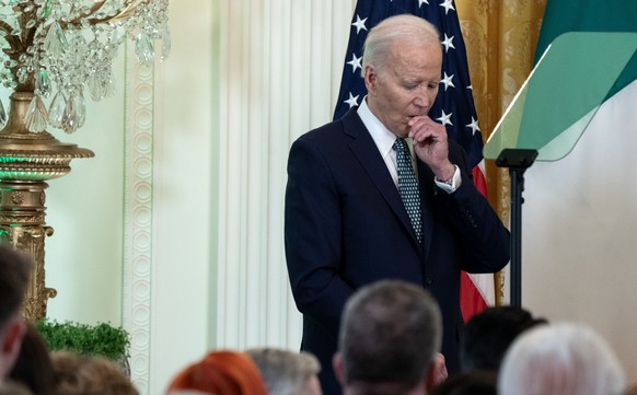 epa11227100 US President Joe Biden reacts as Taoiseach of Ireland Leo Varadkar quotes Beau Biden as he delivers remarks during a St. Patrick's Day celebration in the East Room of the White House…