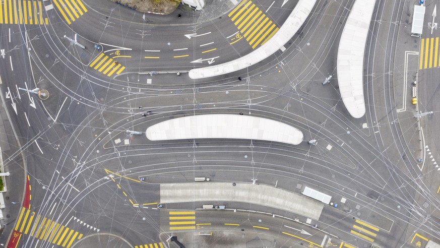epa08330325 An image taken with a drone shows an empty aerial view of the tram and bus station 'Central' in Zurich, Switzerland, 29 March 2020. Switzerland has so far registered over 14267 c ...