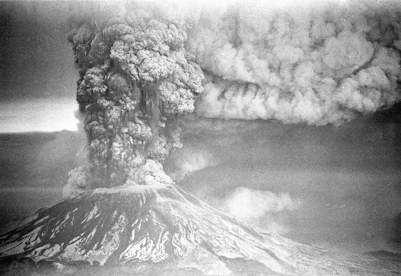 FILE - In this May 18, 1980, file photo, Mount St. Helens sends a plume of ash, smoke and debris skyward as it erupts. May 18, 2020, is the 40th anniversary of the eruption that killed more than 50 pe ...