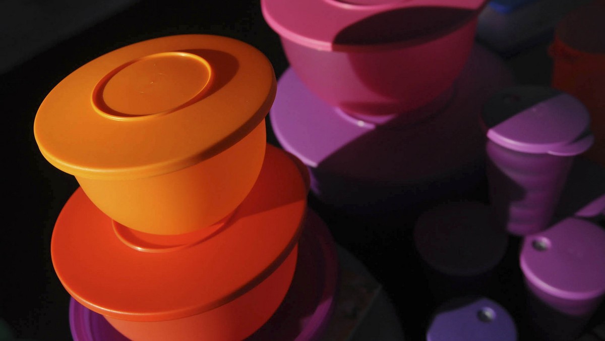 This Friday, Aug. 5, 2011 photo shows some of Kevin Farrell's colorful Tupperware products at a Tupperware party in Bellflower, Calif. Tupperware, it seems, is enjoying a renaissance 65 years aft ...