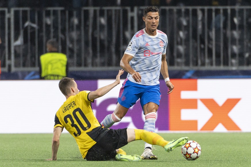Young Boys&#039; Sandro Lauper, left, snatches the ball from Manchester&#039;s Cristiano Ronaldo during the UEFA Champions League group F soccer match between BSC Young Boys and Manchester United, on  ...