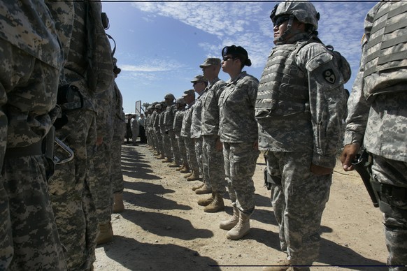 FILE - This Aug. 18, 2010, file photo shows California National Guard troops, who are part of Task Force Sierra, deployed at the border along with Border Patrol Agents near the California/Mexico borde ...