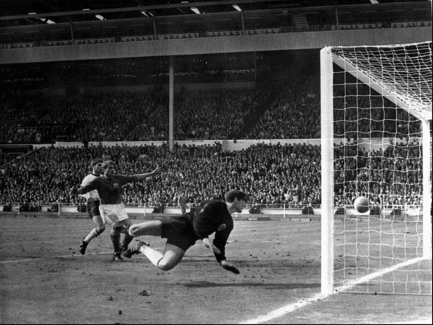 FILE - A shot from England&#039;s Geoff Hurst, not in photo, bounces down from the West Germany crossbar during the World Cup final at London&#039;s Wembley Stadium on July 30, 1966. The linesman gave ...