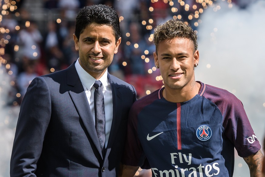 epa06126464 Paris Saint Germain&#039;s chairman and CEO Nasser Al-Khelaifi (L) and Brazilian striker Neymar Jr (R) during Neymar Jr&#039;s official presentation to the public as PSG player prior to th ...