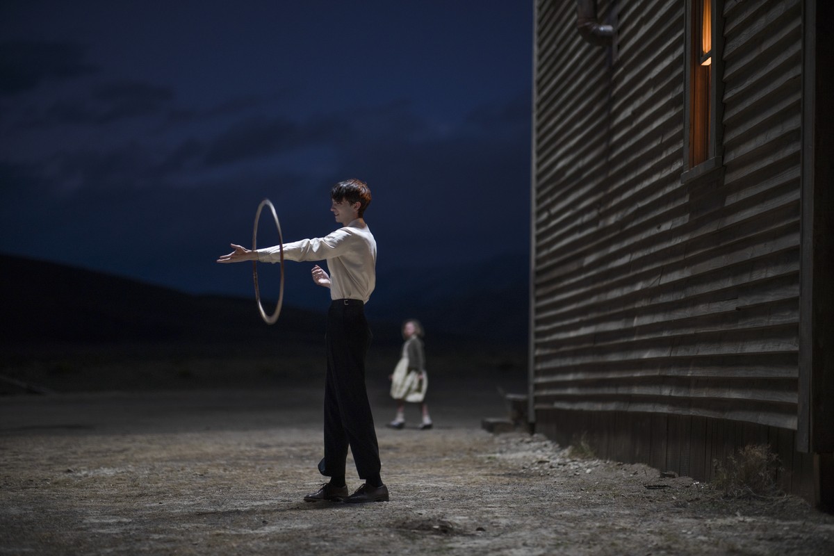 This image released by Netflix shows Kodi Smit-McPhee in a scene from "The Power of the Dog" (Kirsty Griffin/Netflix via AP)