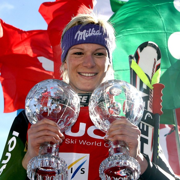 epa04133481 (FILE) A file picture dated 13 March 2008 shows Germany's Maria Riesch posing with her crystal globe trophies on the podium after winning the women's overall Super-G and the Supe ...
