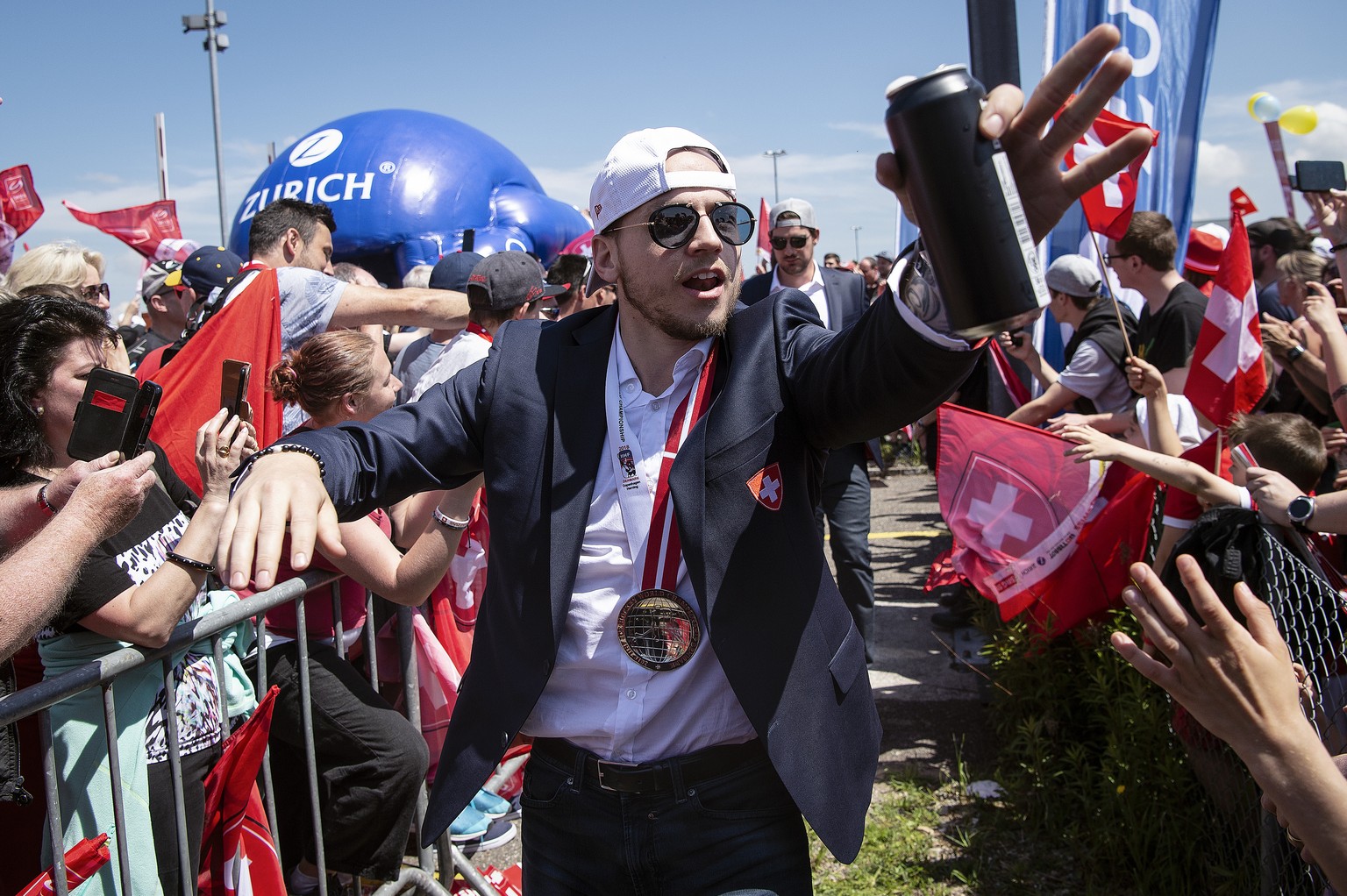 Switzerland’s ice hockey team arrives and is welcomed by fans at Zurich airport in Kloten, Switzerland, Monday, May 21, 2018. Switzerland won the silver medal at the IIHF World Championship in Denmark ...