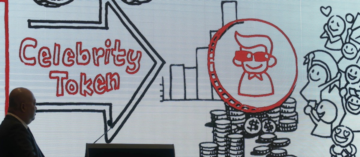Global Crypto Offering Exchange (GCOX) Chief Communications Officer Evan Ngow, left, speaks during a news conference in Hong Kong, Wednesday, March 21, 2018. GCOX, which says it's the world' ...