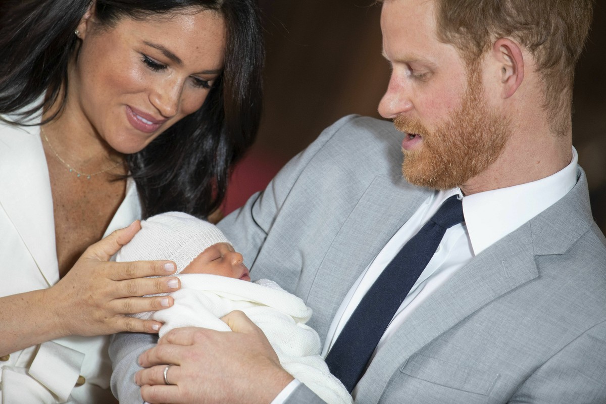 Britain's Prince Harry and Meghan, Duchess of Sussex, during a photocall with their newborn son, in St George's Hall at Windsor Castle, Windsor, south England, Wednesday May 8, 2019. Baby Su ...