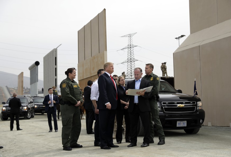 President Donald Trump reviews border wall prototypes, Tuesday, March 13, 2018, in San Diego. (AP Photo/Evan Vucci)