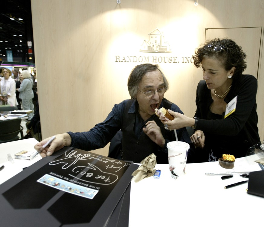 FILE - Artist and author Art Spiegelman gets some help with his lunch from Francoise Mouly, of Random House, Inc., during a signing of Spiegelman&#039;s new book &quot;In the Shadow of No Towers&quot; ...