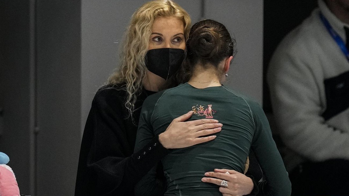 Coach Eteri Tutberidze, left, embraces Kamila Valieva, of the Russian Olympic Committee, during a training session at the 2022 Winter Olympics, Saturday, Feb. 12, 2022, in Beijing. (AP Photo/Bernat Ar ...