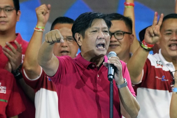 Presidential hopeful, former senator Ferdinand &quot;Bongbong&quot; Marcos Jr., the son of the late dictator, gestures as he greets the crowd during a campaign rally in Quezon City, Philippines on Wed ...