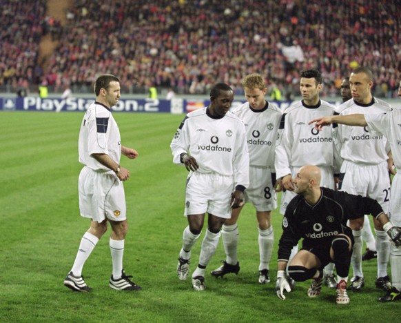 18 Apr 2001: Karl Power a Manchester United supporter becomes an instant legend as he is spotted by Manchester United players after being in the team group posing as Eric Cantona before the UEFA Champ ...