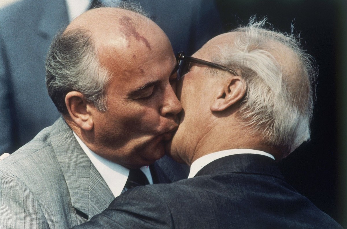 FILE - Soviet Communist Party leader Mikhail Gorbachev, left, and East Germany's state and Communist party leader Erich Honecker exchange kisses at East Berlin's Schoenefeld airport on Wedne ...