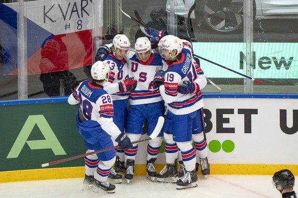 epa12120363 Frank Nazar of the US celebrates with his teammates after scoring the 2-2 goal during the IIHF 2025 Ice Hockey World Championship preliminary round group B game between Czech Republic and  ...