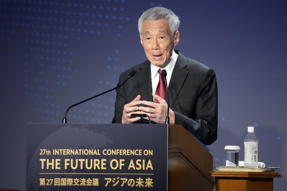 FILE - Singapore Prime Minster Lee Hsien Loong delivers a speech at a session of the International Conference on &quot;The Future of Asia&quot; in Tokyo Thursday, May 26, 2022. Singapore announced it  ...