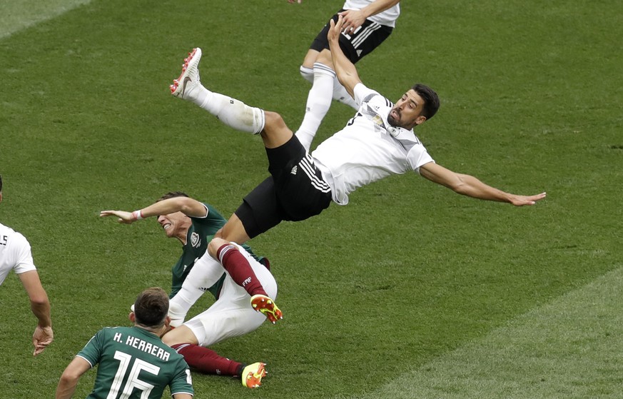 Germany&#039;s Sami Khedira falls over Mexico&#039;s Hector Moreno during the group F match between Germany and Mexico at the 2018 soccer World Cup in the Luzhniki Stadium in Moscow, Russia, Sunday, J ...