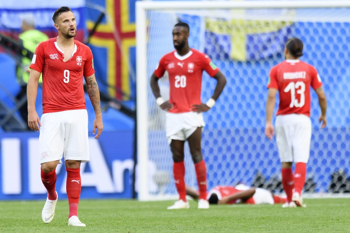 From left, Switzerland's forward Haris Seferovic, Switzerland's defender Johan Djourou, Switzerland's defender Manuel Akanji and Switzerland's defender Ricardo Rodriguez look disap ...
