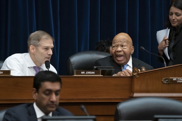 House Oversight and Reform Committee Chairman Elijah Cummings, D-Md., right, turns to Rep. Jim Jordan, R-Ohio, the ranking member, as Cummings leads the vote to subpoena presidential counselor Kellyan ...