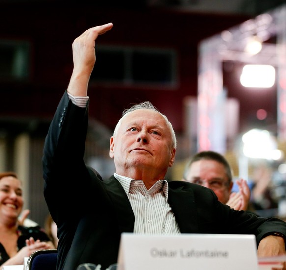 epa03744817 The Left Party former chairperson Oskar Lafontaine sits during the federal party convention in Dresden, Germany, 14 June 2013. The Left Party is preparing for its election campaign for the ...